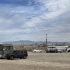 A camper van and converted school bus on the shores of the Salton Sea.